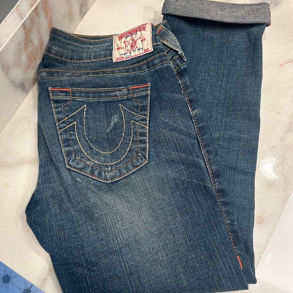 True Religion distressed, low-rise Lizzy cropped jeans w/ Contrast Stitching